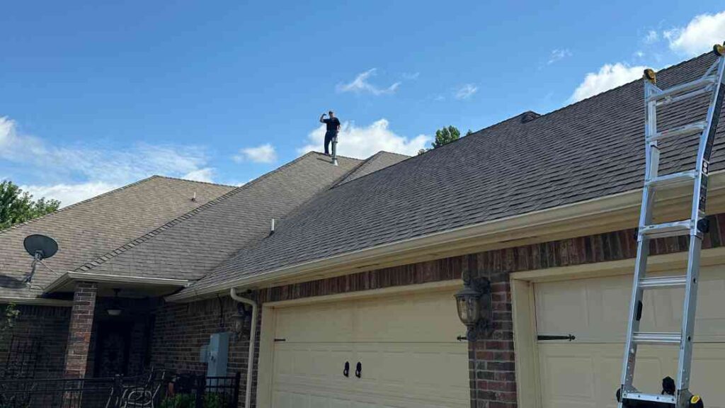 roofer on home in Oklahoma City answering most common roof inspection FAQs from homeowner