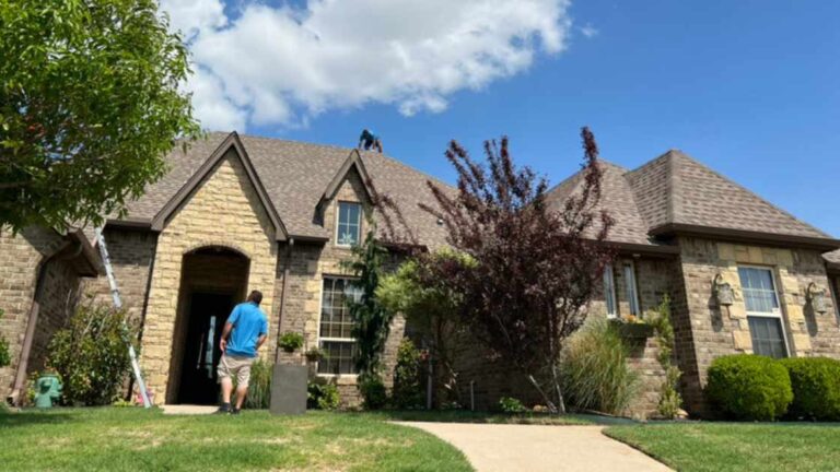 roofer at home completing storm assessment for hail damage