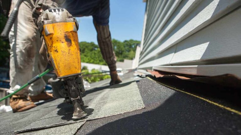 homeowner file a storm damage claim and roofer is installing new shingles