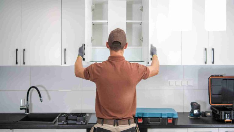 contractor in kitchen reviewing home remodeling trends