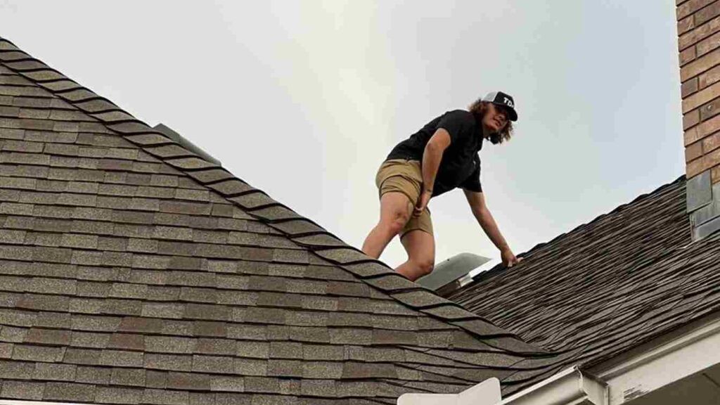 roof inspector completing inspection after storm and debunking storm damage claim myths