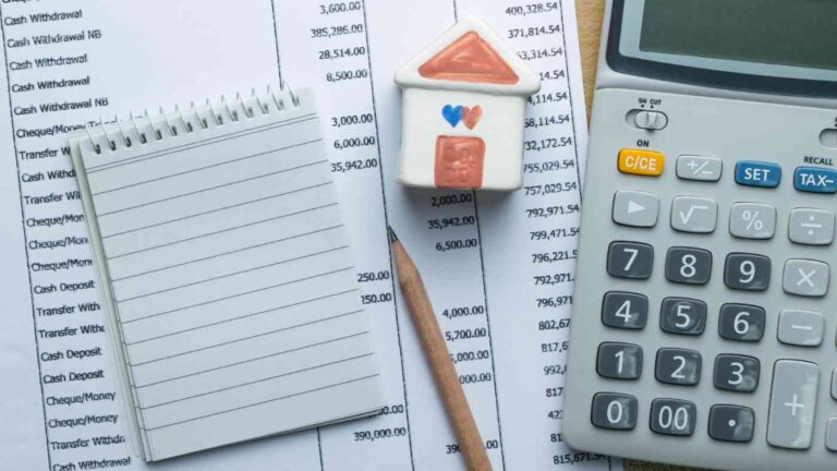 Home maintenance budget planning with a calculator and checklist
