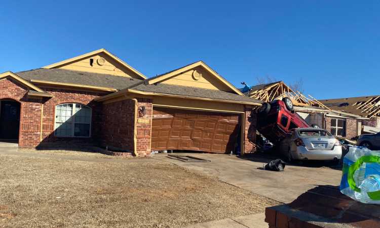 OKC roofer helping homeowner in Norman, OK with tornado damage by completing emergency roof repairs