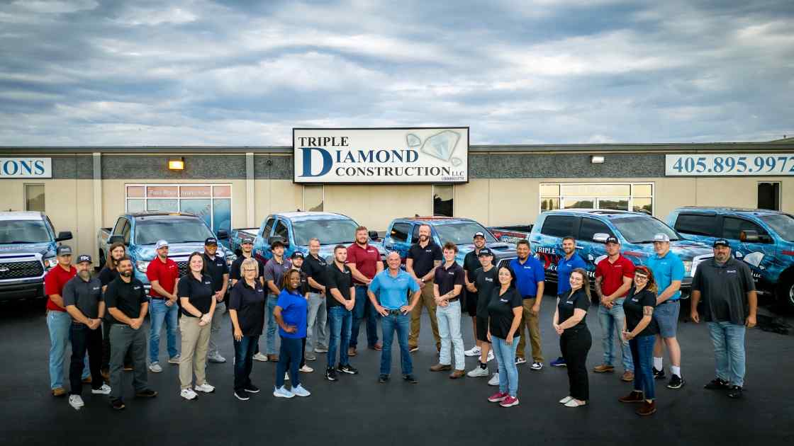 OKC roofing company team outside of office building