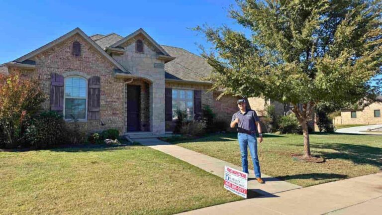 roofer in front of home explaining Oklahoma City housing market in 2025