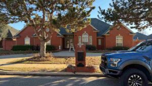 Triple Diamond Construction truck outside of residential home ready to give inspection to determine if home needs roof repair vs roof replacement