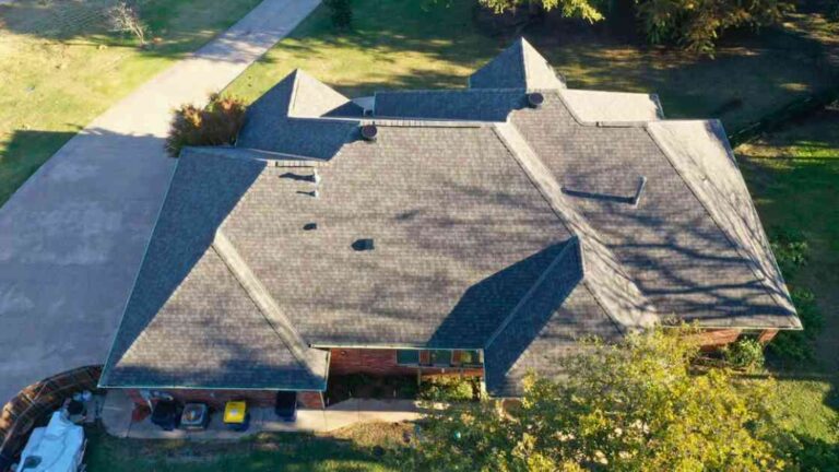 drone photo showing residential home after storm damage repairs in Choctaw