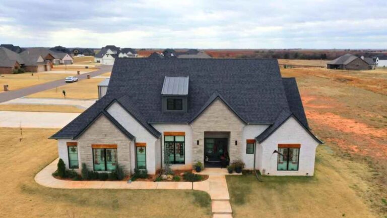 residential home with new roof after storm damage repairs in Guthrie, OK