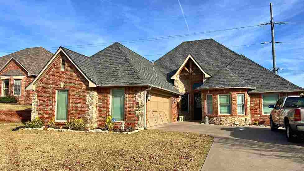 photo of residential home exterior from the front before storm damage repairs were completed