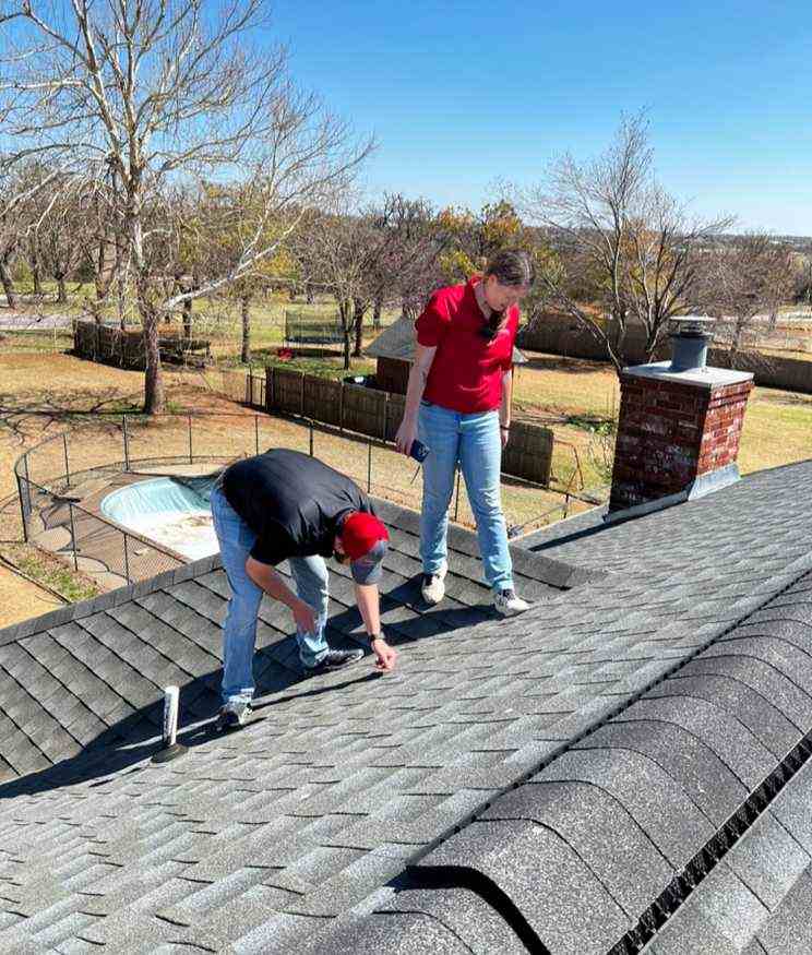 okc roofing company doing roof inspection for homeowner