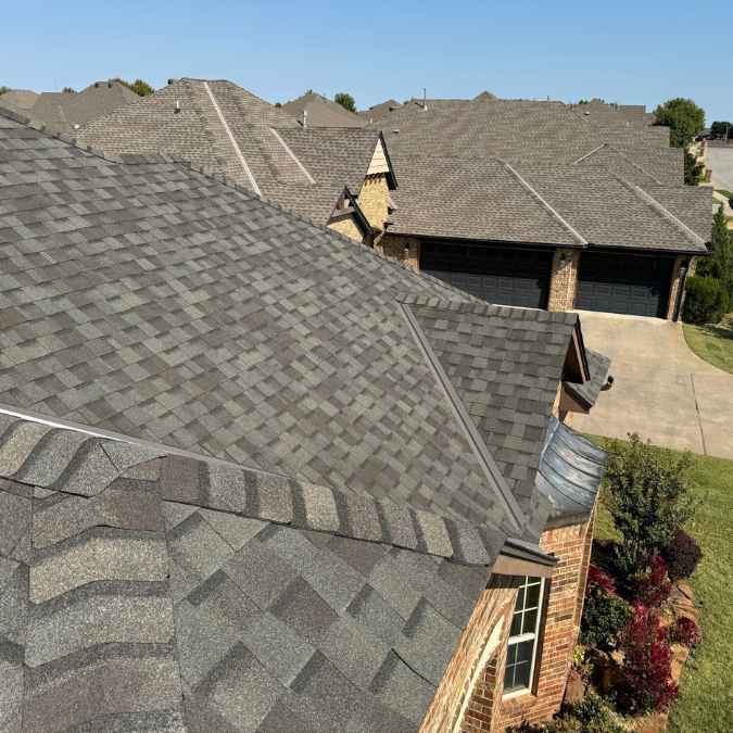 photo from drone showing residential roof from above after hail damage repairs were completed in Oklahoma City