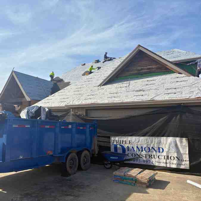 old shingles removed and put in dumpster near home and new waterproof barrier being installed on roof deck