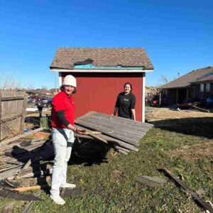 roofing crew helping clean up tornado damage in Norman, OK