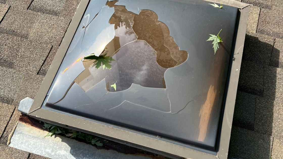 hole in skylight caused from hail storm in Oklahoma City