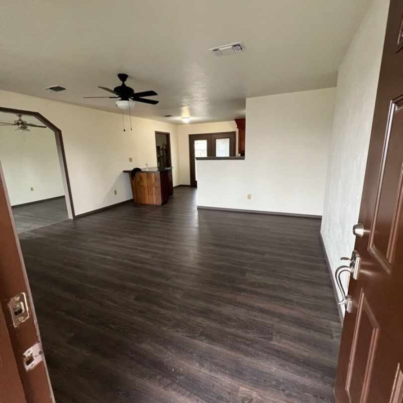 remodeled home living room after tornado damage repairs were completed by general contractor