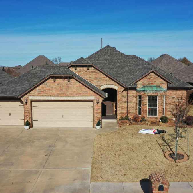 front view of residential home in Oklahoma City showing new roof