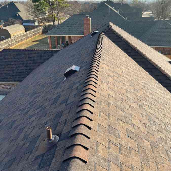 photo of new roof shingles from top angle of home