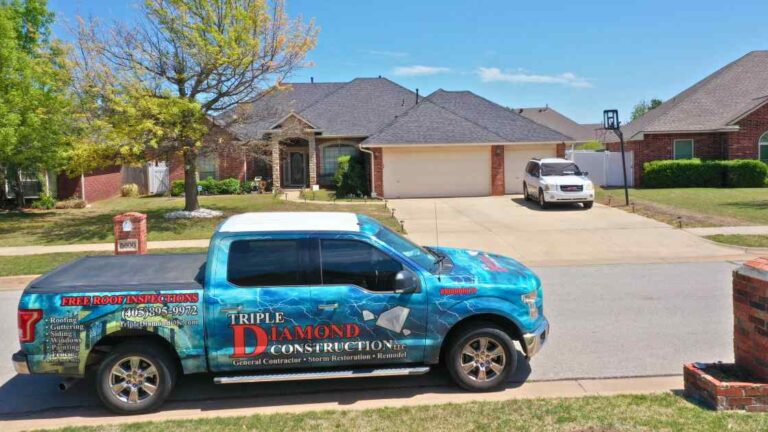 roofer and truck outside of residential home giving storm safety tips to homeowner before storm season in Oklahoma City