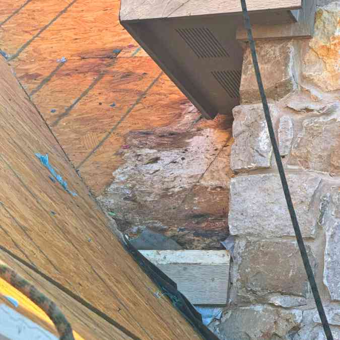 close up of rotting roof decking after months of roof leaks