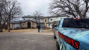Triple Diamond Construction roofer standing with homeowner discussing why roof over 10 years old can cause problems in Oklahoma City