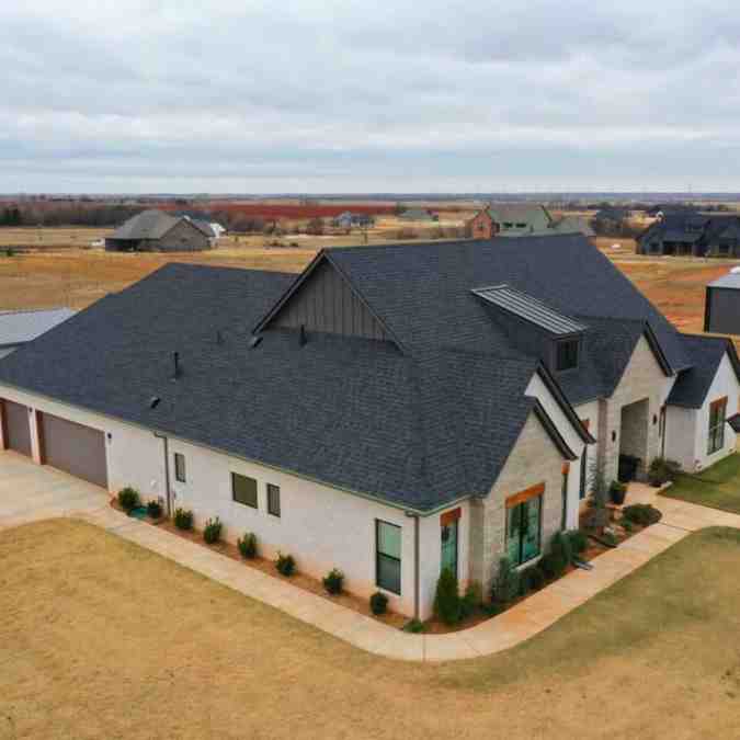 completed roof after hail storm in Guthrie, OK damaged roof, gutters and windows.