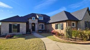 outside front view of home after full roof replacement in Moore, OK