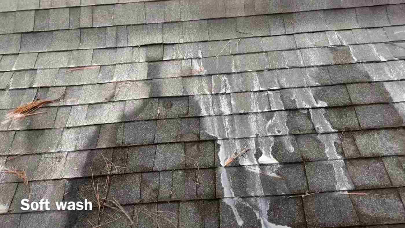 soapy water being thrown onto roof shingles is best way to clean black streaks off of roof