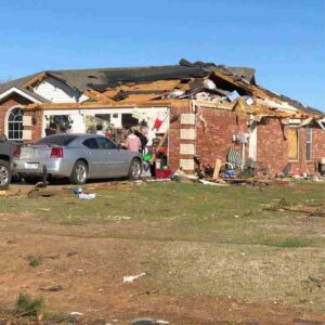 house with tornado damage after February, 26 storm in Norman, OK